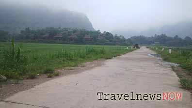 Peaceful Mai Chau Valley shrouded in thin fog in the early morning