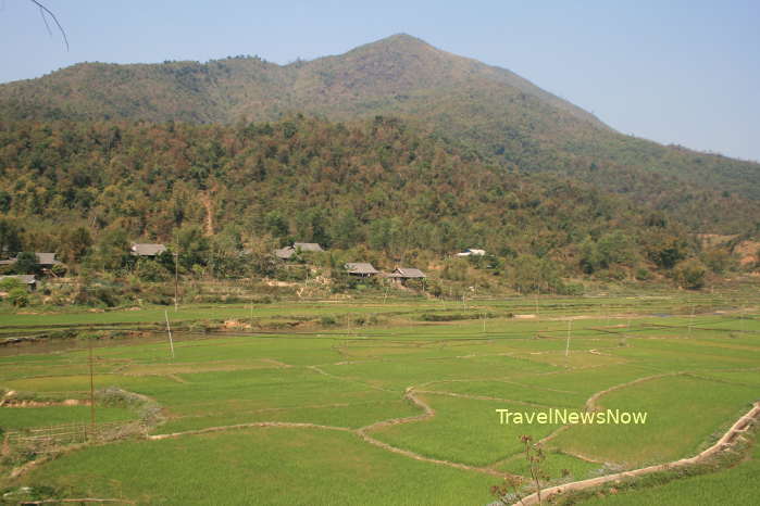 Rice fields, an ethnic village and mountains at Tuan Giao, Dien Bien Province