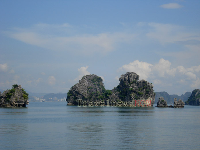 Islands on Halong Bay and a distant view of Halong City